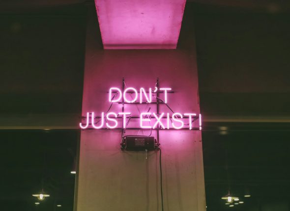 purple Don't Just Exist neon signage turned-on