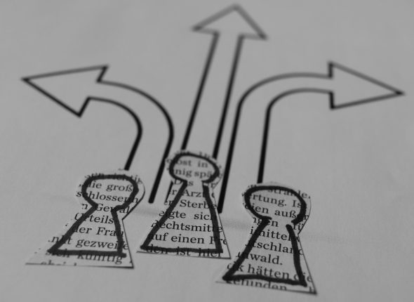 a close up of a piece of paper with arrows