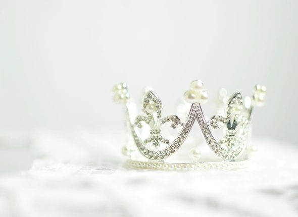 shallow photography of silver-colored crown