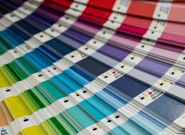 A bunch of different colors of paint on a table
