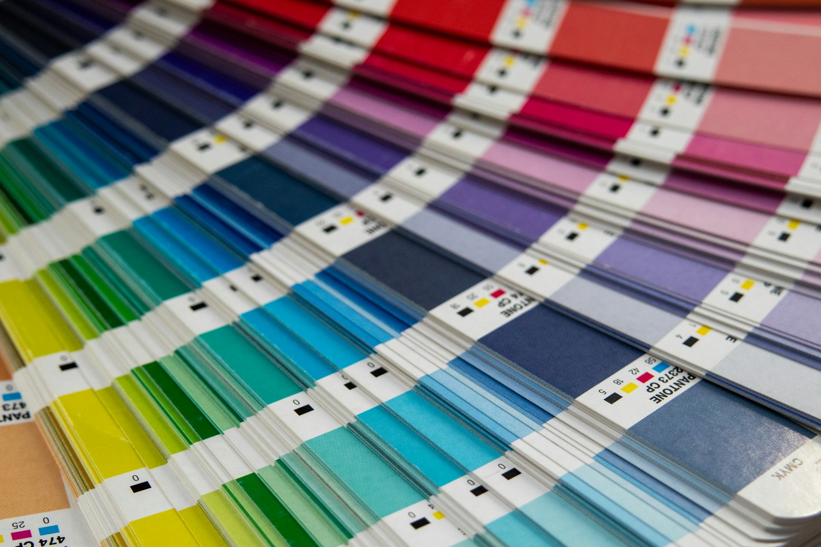 A bunch of different colors of paint on a table